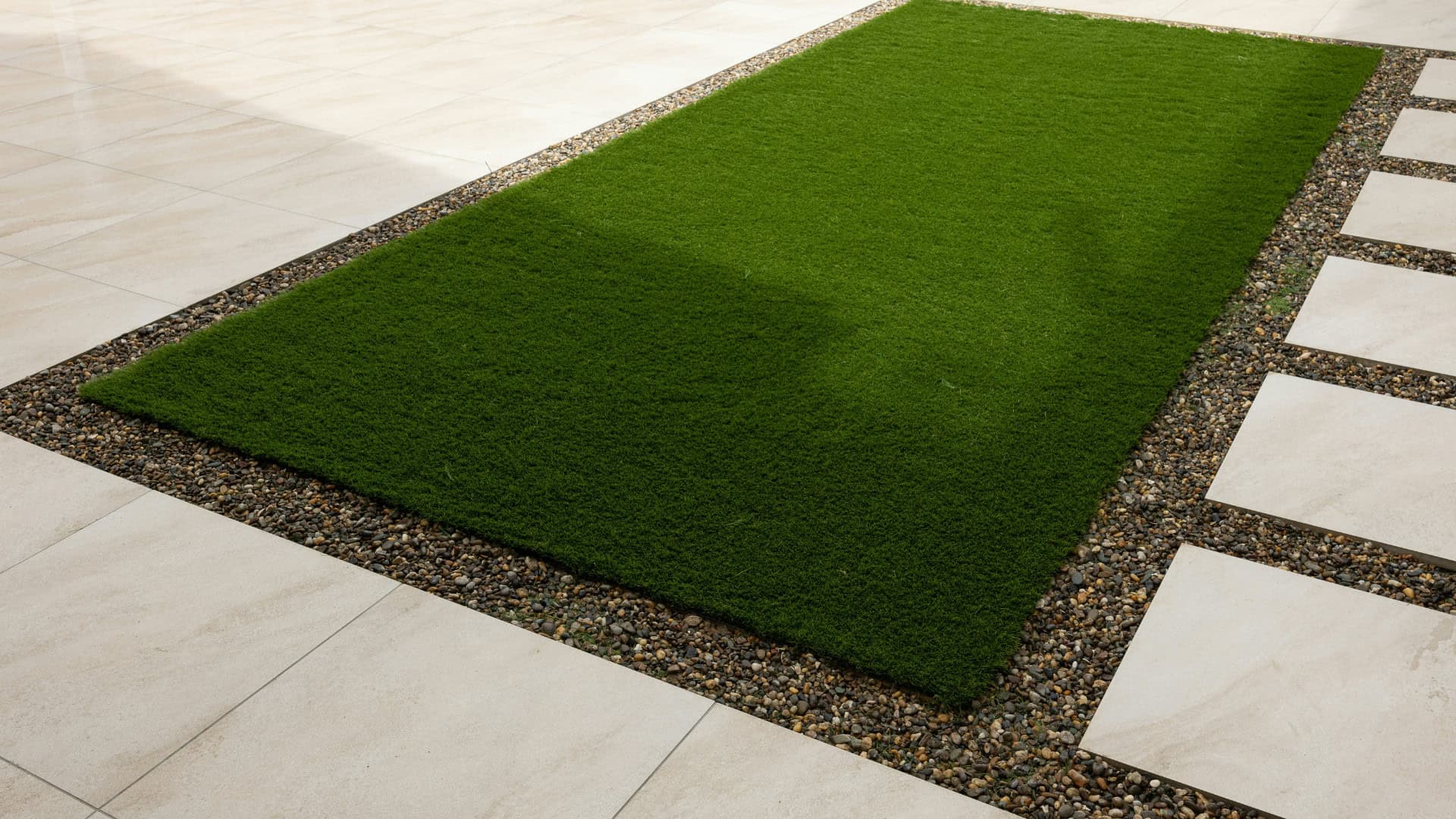unusual paving desigh interlaced with artificial grass
