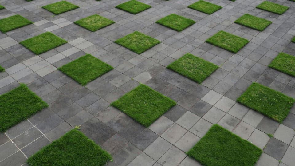 stone paving with artificial grass alternating between paving