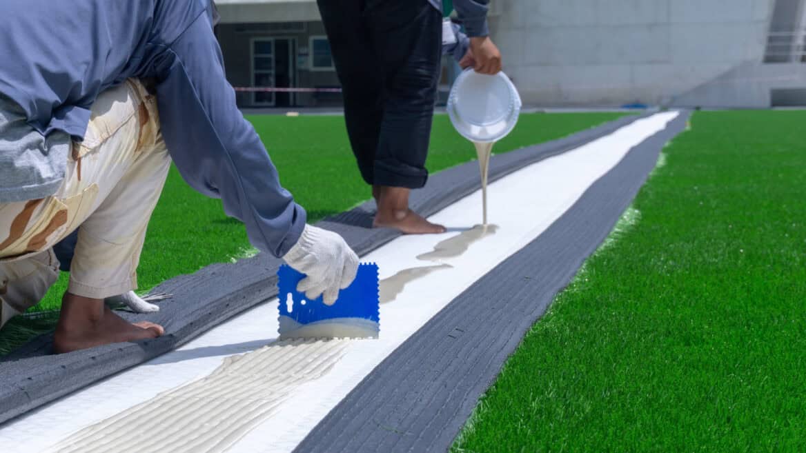 artificial grass base being prepared for installation
