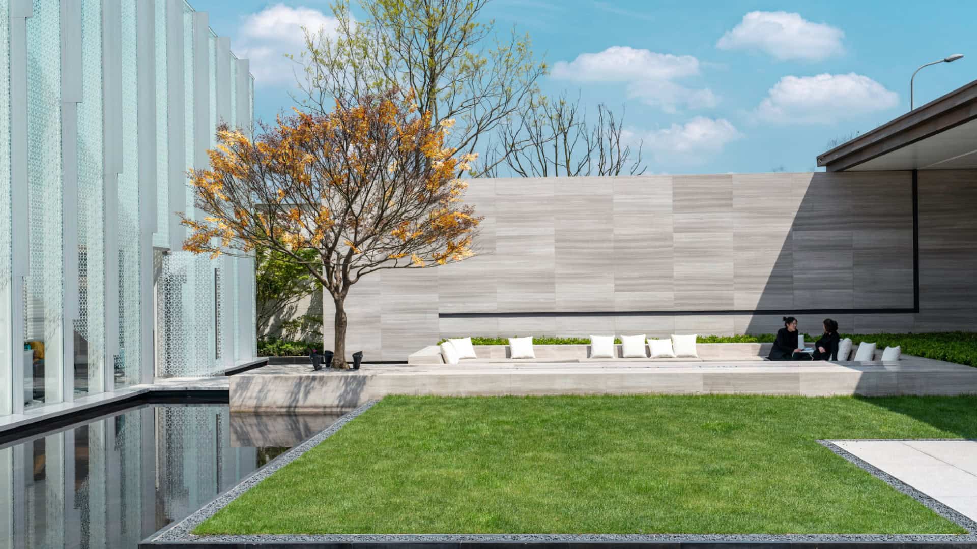 modern garden with artificial grass around a pool area