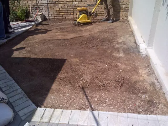 soil surface being prepared for artificial grass installation